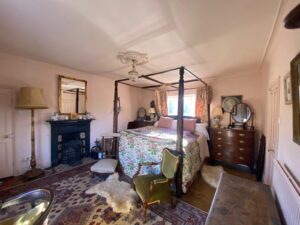 View of a bedroom with fourposter bed